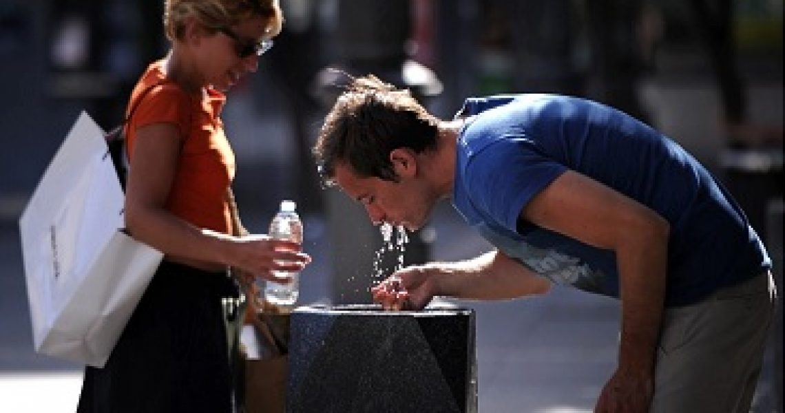 Drinking From Fountain